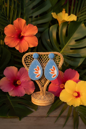 Beaded jewelry earrings by Azvera Studio featuring colorful beads and intricate design, hanging gracefully against a neutral background.