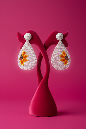 Azvera Studio Bloom beaded earrings featuring colorful beads and intricate jewelry design on a white background.