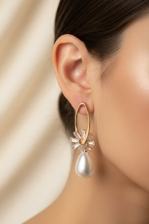 Celeste Pearl Drop Earrings by Azvera Studio featuring elegant pearl drops and delicate silver hooks.
